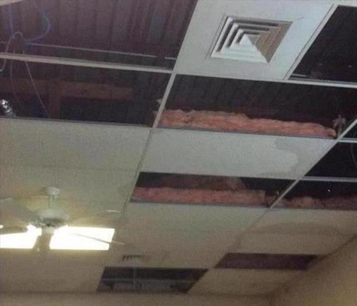 opened ceiling, damaged tiles and insulation
